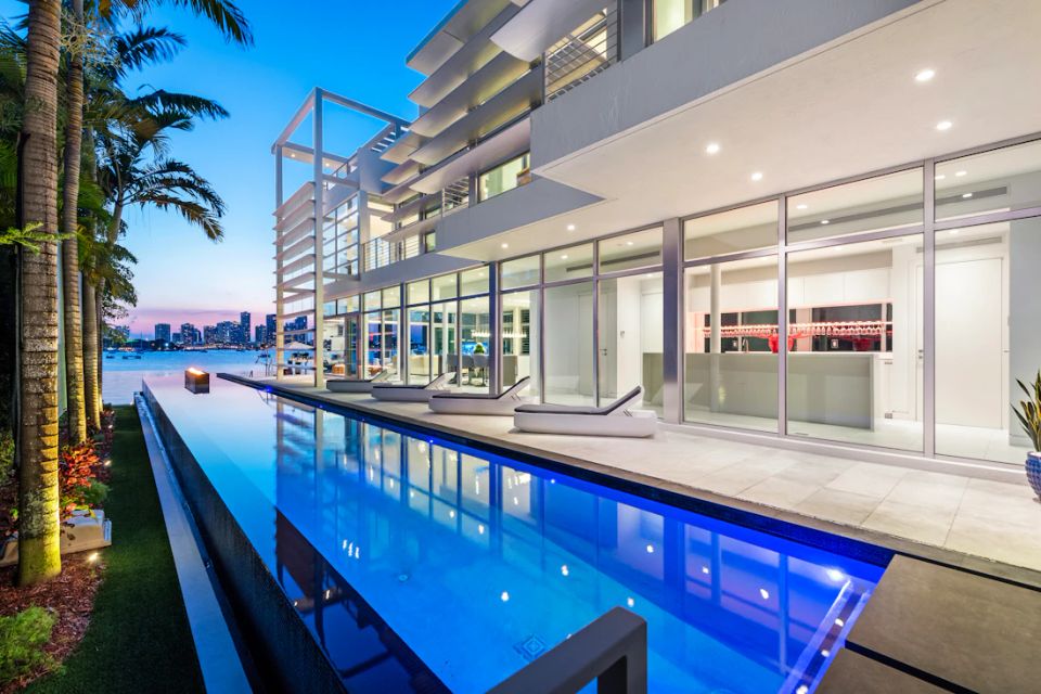 Glass architecture, open rooms and a waterfront swimming pool